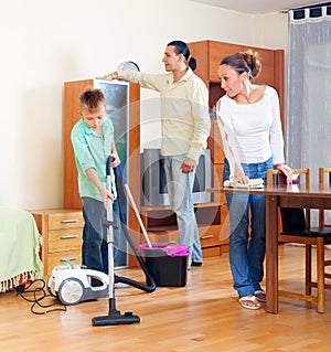 Parents and boy cleaning together