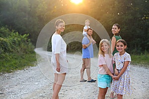 Parents with children in countryside outdoors