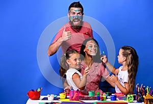 Parents and children painted with gouache on blue background