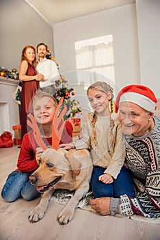 Parents and children with pet on holiday