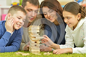 Parents and children playing with blocks