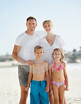 Parents, children and portrait on beach for holiday relax on island or bonding, connection or vacation. Man, woman and