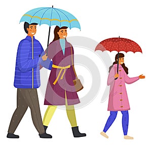 Parents and daughter spend time together walking on a rainy move down the street isolated on white