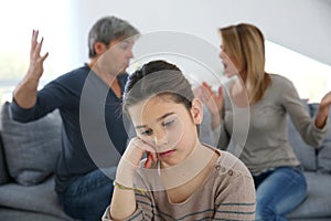 Parents fighting in front of their daughter photo