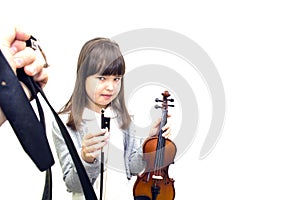 Parents force the child to play the violin.