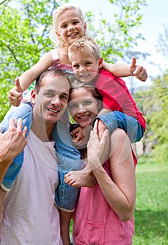 Parents giving their children piggy-back ride