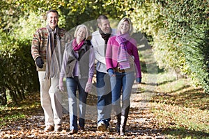 Parents and grown up children on walk