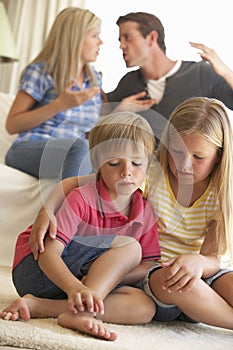 Parents Having Argument At Home In Front Of Children