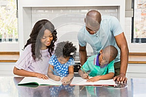 Parents helping children doing homework