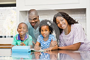 Parents helping children doing homework