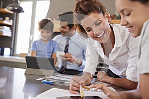 Parents Helping Children With Homework Before Going To Work