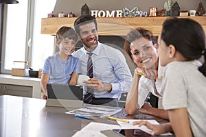 Parents Helping Children With Homework Before Going To Work