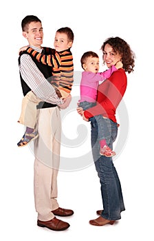 Parents hold children on hands