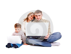 Parents and kid with laptop