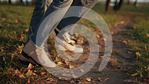 Parents kid leg walking autumn park field together closeup. Outdoor leisure time