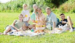Parents with kids having picnic