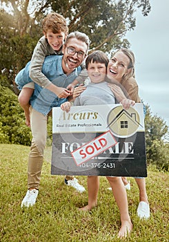 Parents, kids and property with sold sign, portrait and smile for new home, start and investment for future. Father