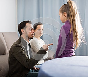 Parents lecturing daughter