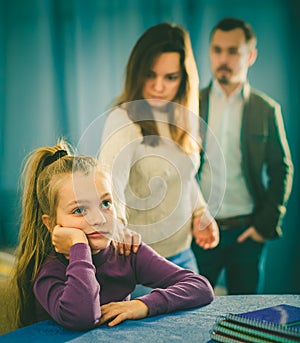 Parents lecturing daughter