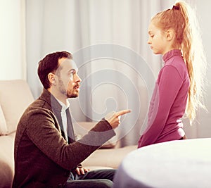 Parents lecturing daughter