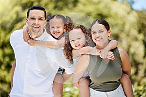 A parents love is the best kind of love. Portrait of a happy young family enjoying a fun day out at the park.