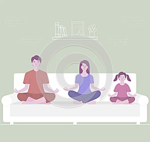 Parents meditating with kid, sitting on white sofa