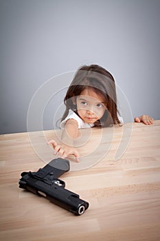 Parents not keep gun in safe place, children can have gun for accident. safety concept