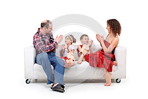 Parents play with children white leather sofa