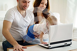 Parents playing developing game with son