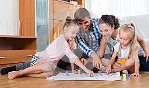 Parents playing with kids at home