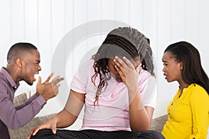 Parents Quarreling Behind Upset Girl