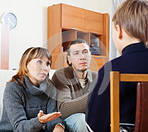 Parents scolding teenager