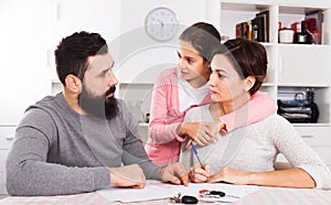 Parents signing papers for divorce