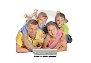 Parents with sons using laptop