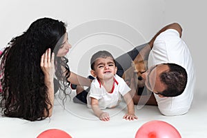 Parents take care of child. Little small crying shouting baby