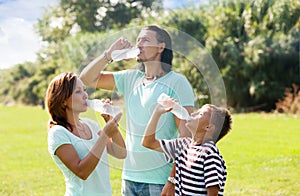 Parents with teenager drinking clean water