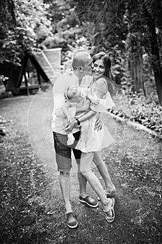 Parents with their baby girl walking outdoors