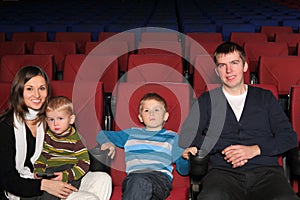 Parents with their two sons in cinema