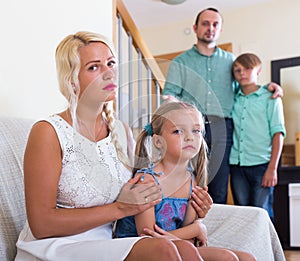 Parents and two kids in conflict at home