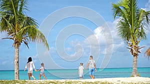 Parents with two kids enjoy their caribbean vacation on Antigua island