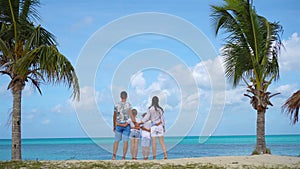 Parents with two kids enjoy their caribbean vacation on Antigua island