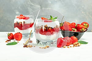 Parfait with yogurt, granola, jam, fresh berries and mint leaves in glass jar. gluten free diet, Healthy breakfast. banner, menu,