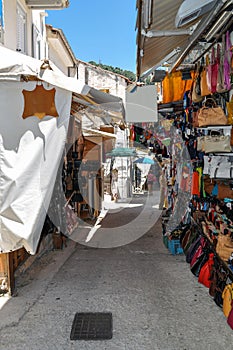 Parga, Epirus - Greece. Narrow street in the town of Parga, gift shops, souvenirs