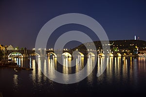 Pargue charles bridge by night reflections river