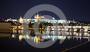 Pargue charles bridge and prague castle by night reflections river