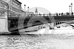Paris in black & white. Sailing on the river Seine under the bridges of the city