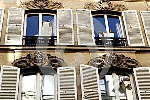 Paris building facades with white shutters