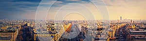 Paris cityscape sunset panorama from the triumphal arch with view to parisian avenues and Champs-Elysee in the center. Beautiful