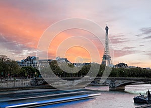 Paris with Eiffel Tower against colorful sunset in France