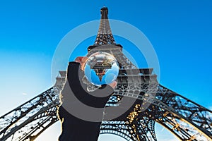 Paris, Eiffel tower through the glass ball